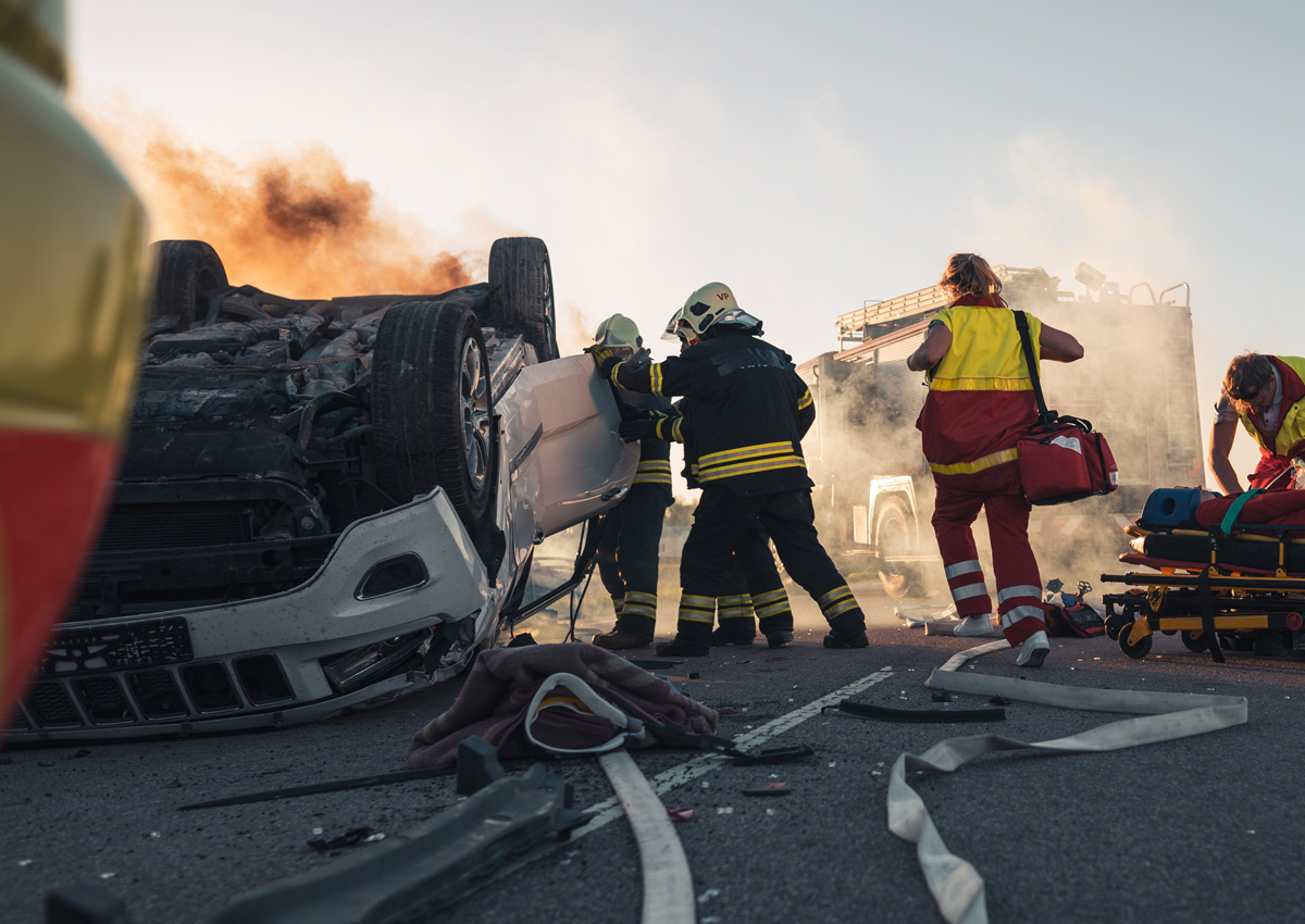 Emergency rescue workers on the scene of a car accident